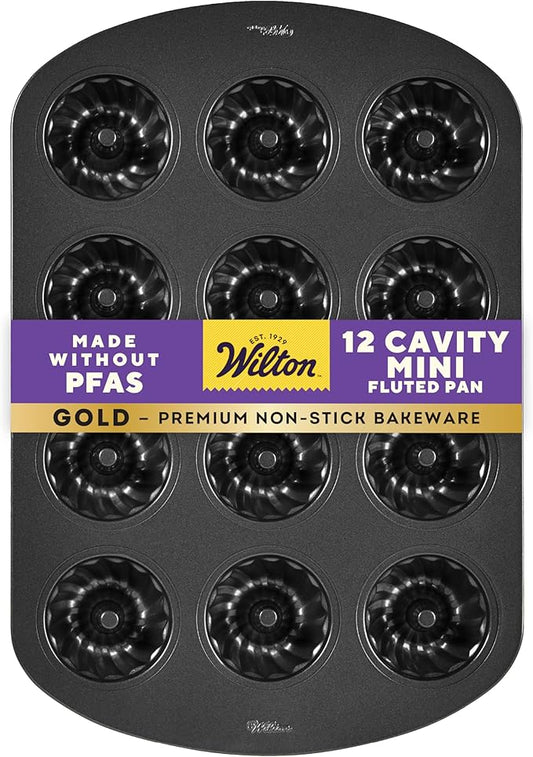 Wilton Gold Non-Stick Bakeware Mini Fluted Pan - Baking Pan for Mini Bundt Cakes, Donuts & More - Made Without PFAS & Scratch Resistant - Offers Even Heat Distribution - 16.5 x 11 Inch, 12-Cavity